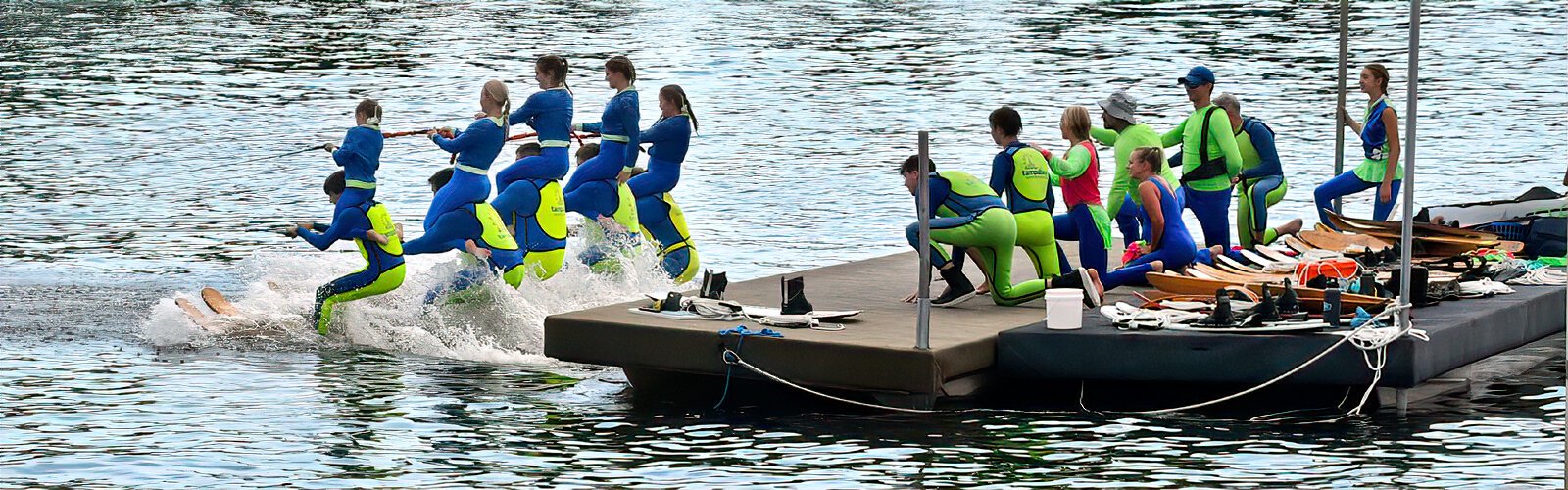  Ready to perform, five pairs of skiers take off from the floating dock on the Hillsborough River.