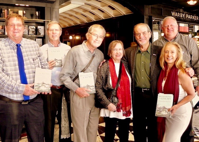 Cafe con Tampa patrons pose with Author Robert Macomber at Oxford Exchange.