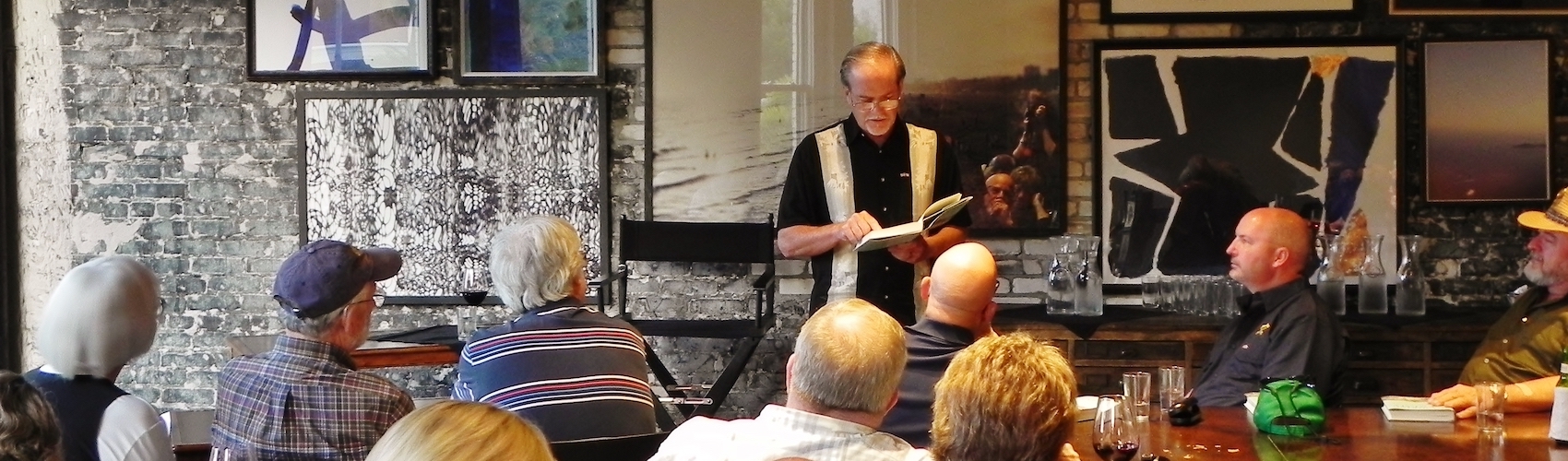 Author Robert Macomber reads aloud from Honoring the Enemy at Oxford Exchange book signing.