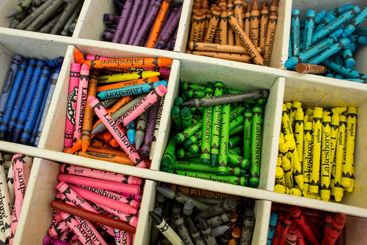 Crayons are used in a stress-relief art session for after-school kids.