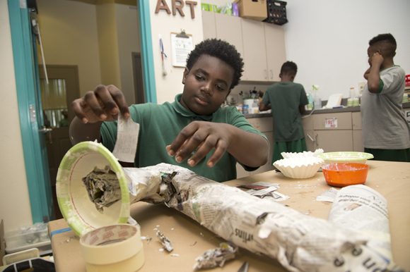Omarion Clark, 12, creates a saxophone sculpture during Amanda Fleischbein's art class at Academy Prep Center of Tampa.