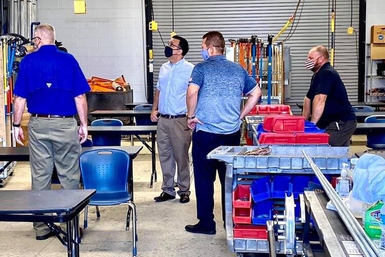 Tampa City Council member Luis Viera (in lightest blue shirt) tours International Brotherhood of Electrical Workers Chapter 915 in Tampa.