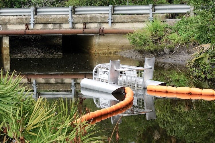 A newly deployed Litter Gitter device sits in the waters of Archie Creek in Hillsborough County.