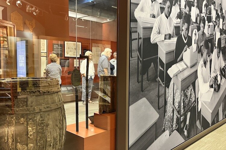 Visitors tour Travails and Triumphs at the Tampa Bay History Center.