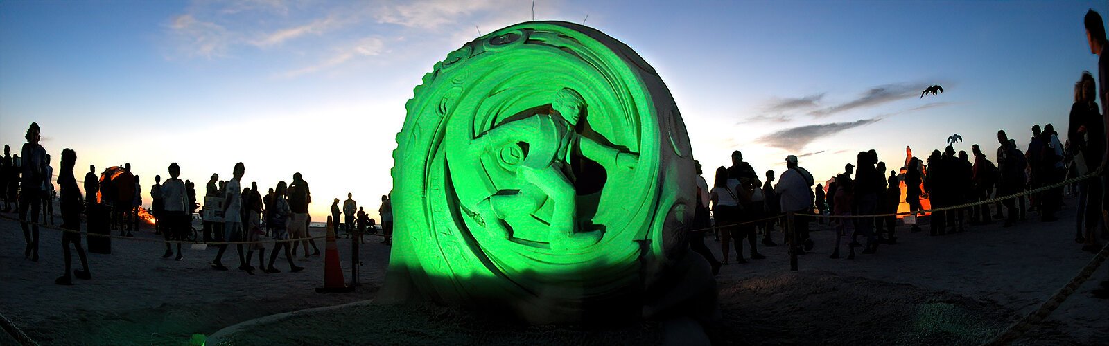 Illuminated by green flood lights, “Time Warp” by Benoit Dutherage of France was part of the recent Sanding Ovations sand sculpture exhibit on Treasure Island.
