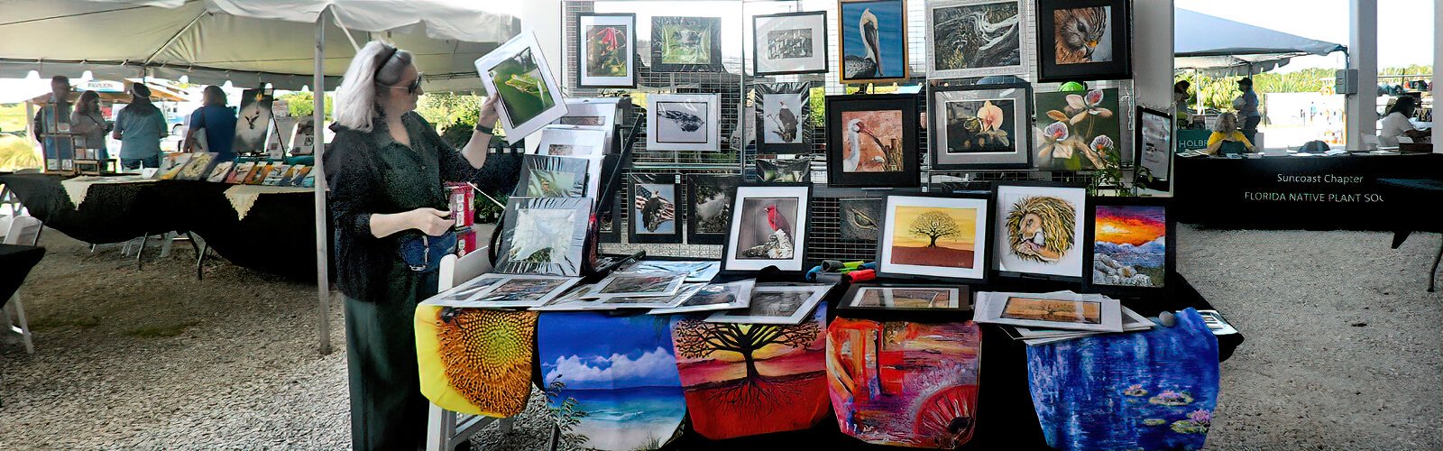 Artist Bibzie Priori displays her artwork and her husband Roger Sheets’ photographs at the Florida Birding and Nature Festival Nature Expo.