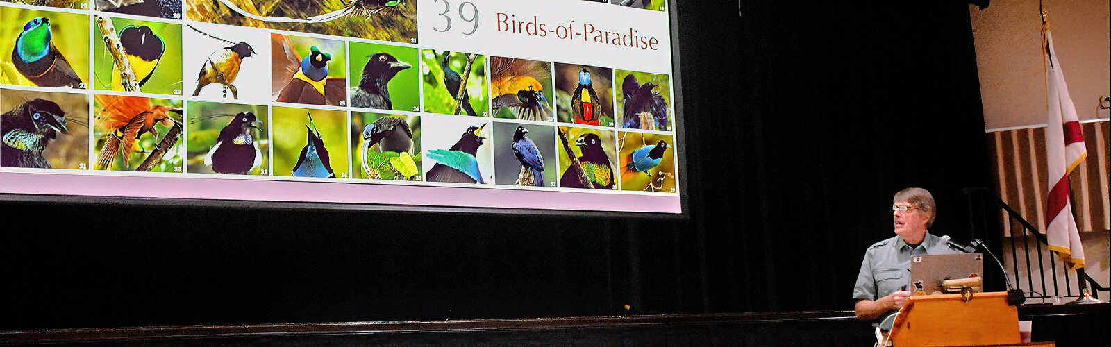 Keynote speaker Tim Laman, an ornithologist and National Geographic photographer, presents the various species of birds-of-paradise he photographed for the iconic magazine.