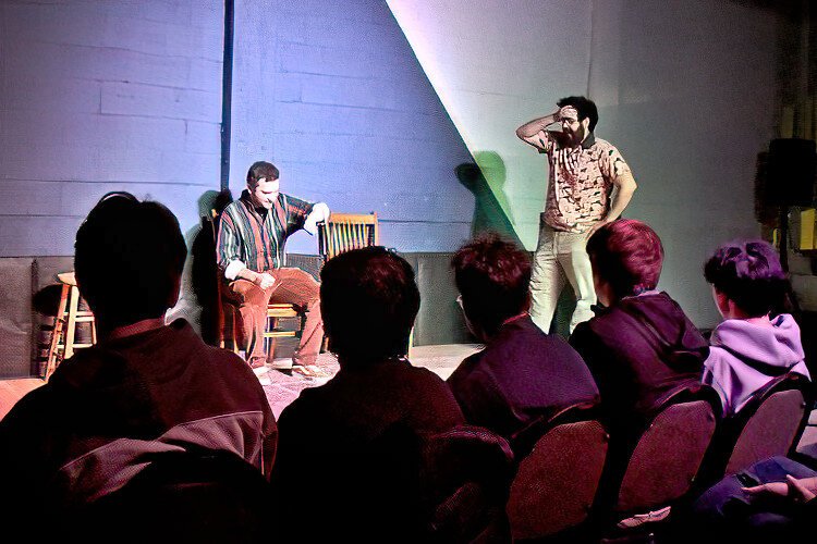 The audience at The Commodore in Ybor City watches as improv performers Alex Utz and Robert Ebeid do their thing.