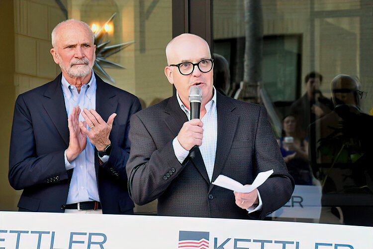  KETTLER Senior Vice President of Multifamily Development Graham Tyrrell speaks at the La Unión fribbon-cutting as founder and CEO Robert Kettler looks on.