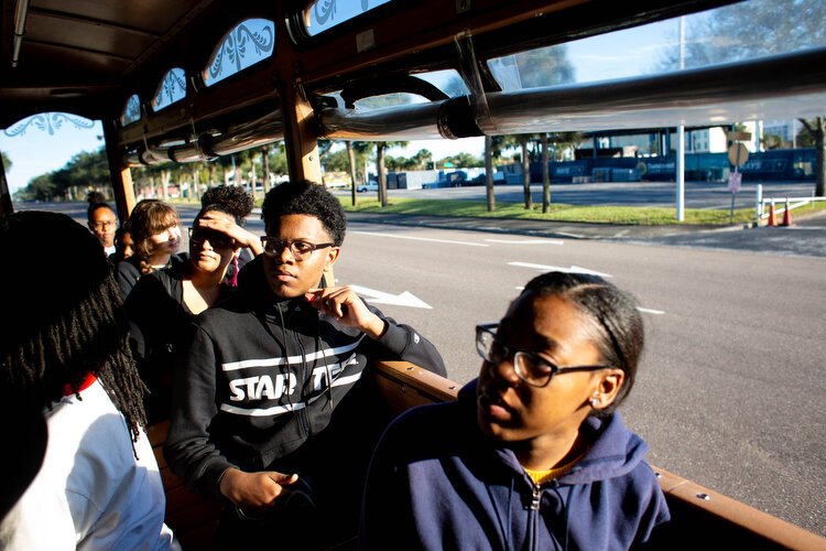 Students pass through the lost neighborhood of Gas Plant where 285 buildings and 500 houses that were once owned by African Americans in St. Pete, but were forced out to make way for the Tropicana stadium.