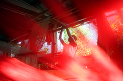 A woman weaves with silk at her small island village near Muang Ngoi in Laos. 