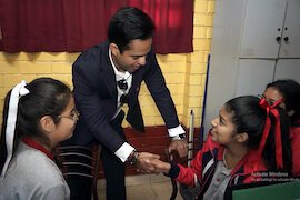 Tony Selvaggio greets students at Fe y Alegria Sustainability Academy in Ventanilla, Peru.