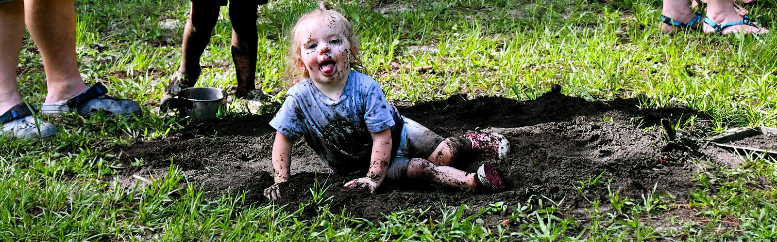 Amelia, 2, has fun at Rooted in Play’s Mud Day adventure at Rowlett Park in Tampa.