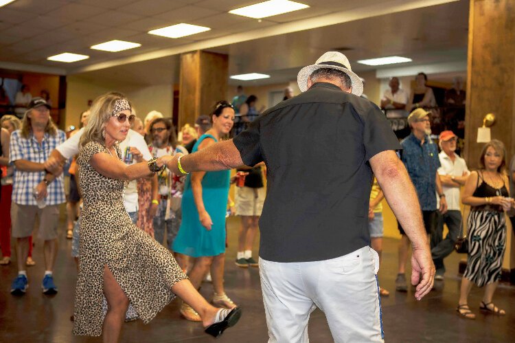 Bradenton's Trivia Williams and Sarasota's Bryan West celebrate his birthday by dancing at  multiple stages during WMNF's Tropical Heatwave.