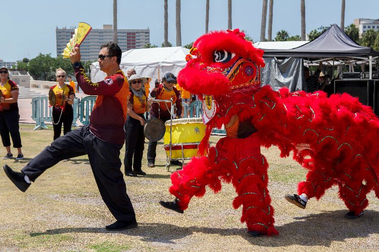 Members of the Suncoast Asian Cultural Association perform the Lion Dance at the Tampa Asian Pacific Islander Cultural Festival at Curtis Hixon Waterfront Park.