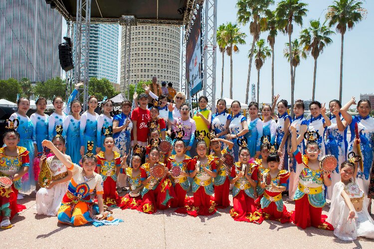Tampa Mayor Jane Castor joins a group of the 200-plus performers who participated in the city's Asian Pacific Islander Cultural Festival at Curtis Hixon Waterfront Park. 