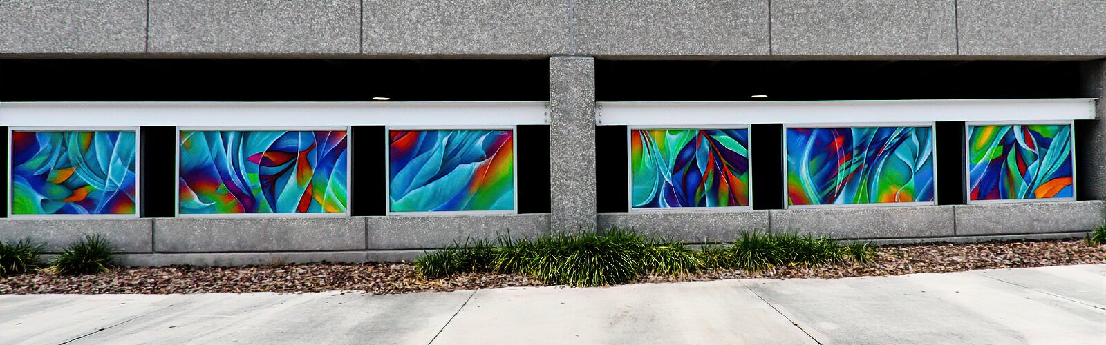 The Myrtle Street side of the Clearwater Municipal Parking Garage is now decorated with multiple murals painted by street artist Dreamweaver.