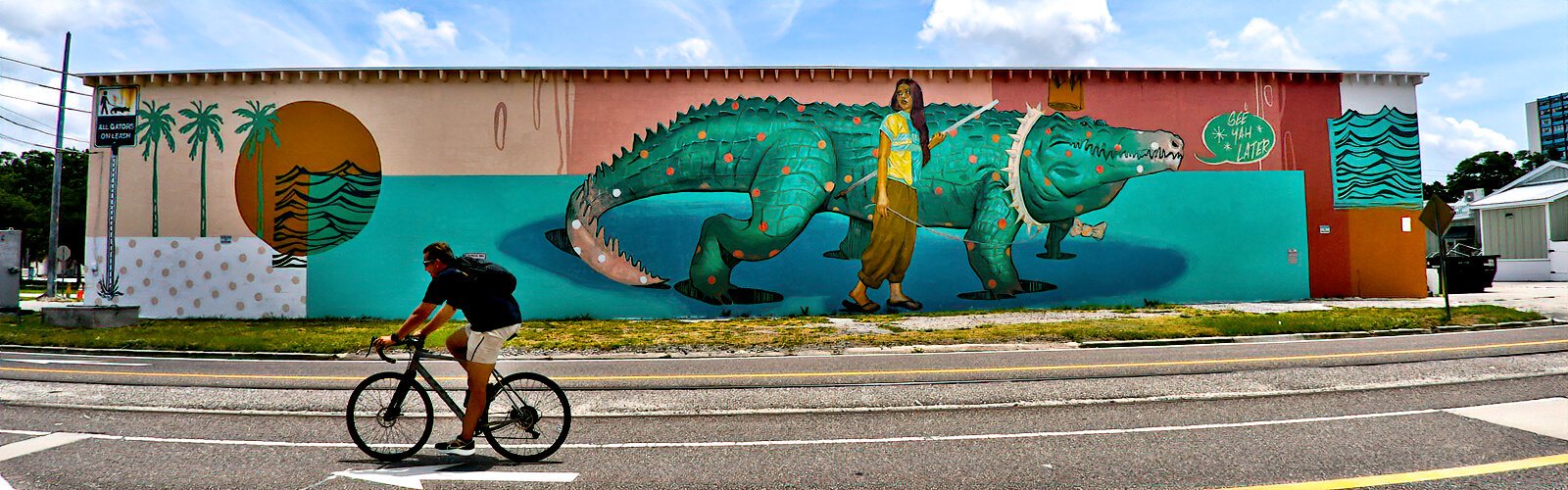 Created by muralists MJ Lindo-Lawyer and Joshua Lawyer in 2021, the whimsical "After a While” mural at South East Avenue and Franklin Street depicts a woman out for a walk with her pet alligator.