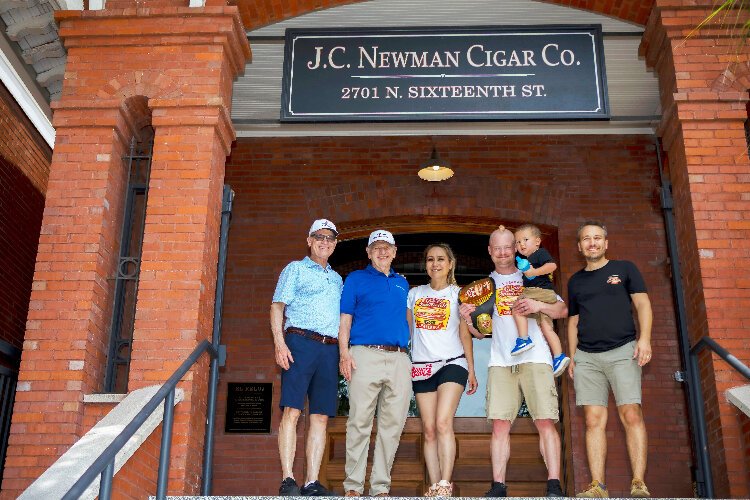 J.C. Newman Cigar Co.’s third-generation owners Bobby Newman and Eric Newman, the  "Power Couple of Competitive Eating," Miki Sudo and Nick Wehry, their son Max, and fourth-generation J.C. Newman owner Drew Newman.