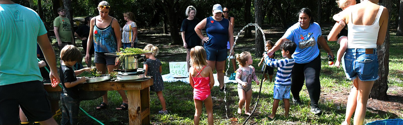  With water hoses ready, it’s time to clean up at the end of a fun, muddy morning.