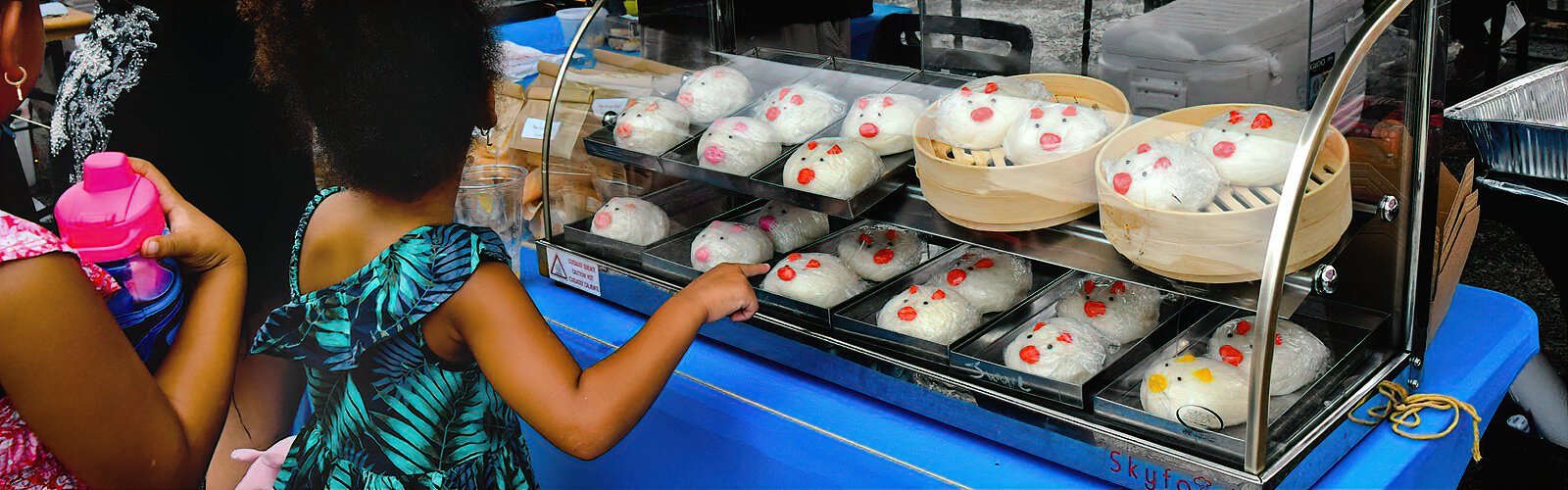 The steamed Chinese pork buns from Joy’s Kitchen are a cute attraction at the Asian Mega Night Street Food Market.