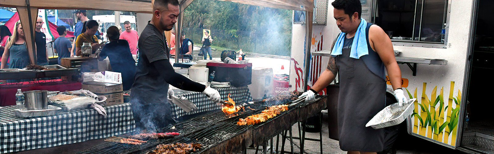 Barbecued meat skewers are prepared on the flame at Maya’s Merienda and Asian Street Foods.