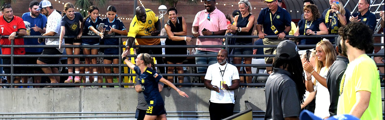 After scoring the tying goal, Sun FC defender Brooke Hendrix high-fives the fans.