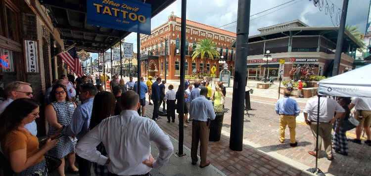 A nice-sized crowd seeks out some shade during the City of Tampa's August 20th bricklaying ceremony and ribbon-cutting to celebrate the finish of the first phase of a project returning Ybor City's East Seventh Avenue to a brick road.