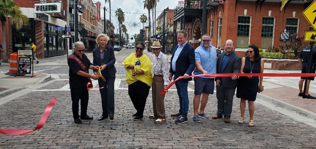 Tampa city officials celebrate the completion of the first phase of the East Seventh Avenue bricking with a ceremonial ribbon-cutting.