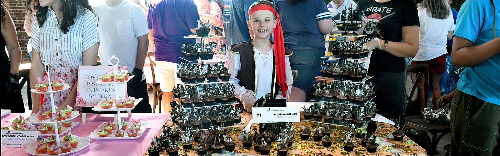 Jacob Waldemer, 10, proudly presents his pirate-themed “Chocolate Storm” in the youth/teen category of the Great St Pete Cupcake Contest.