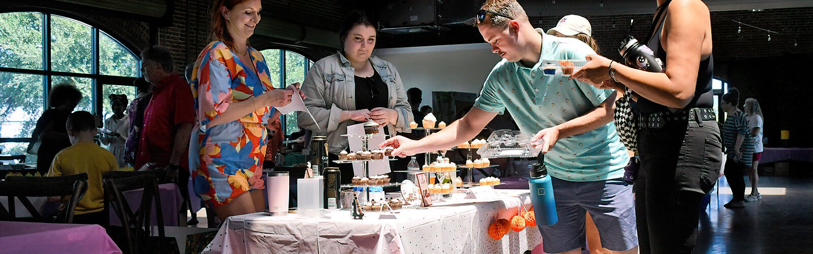 Pre-registered attendees at the Great St Pete Cupcake Contest fill a 12-count box with the mini-cupcakes of their choice and then vote for their favorite.