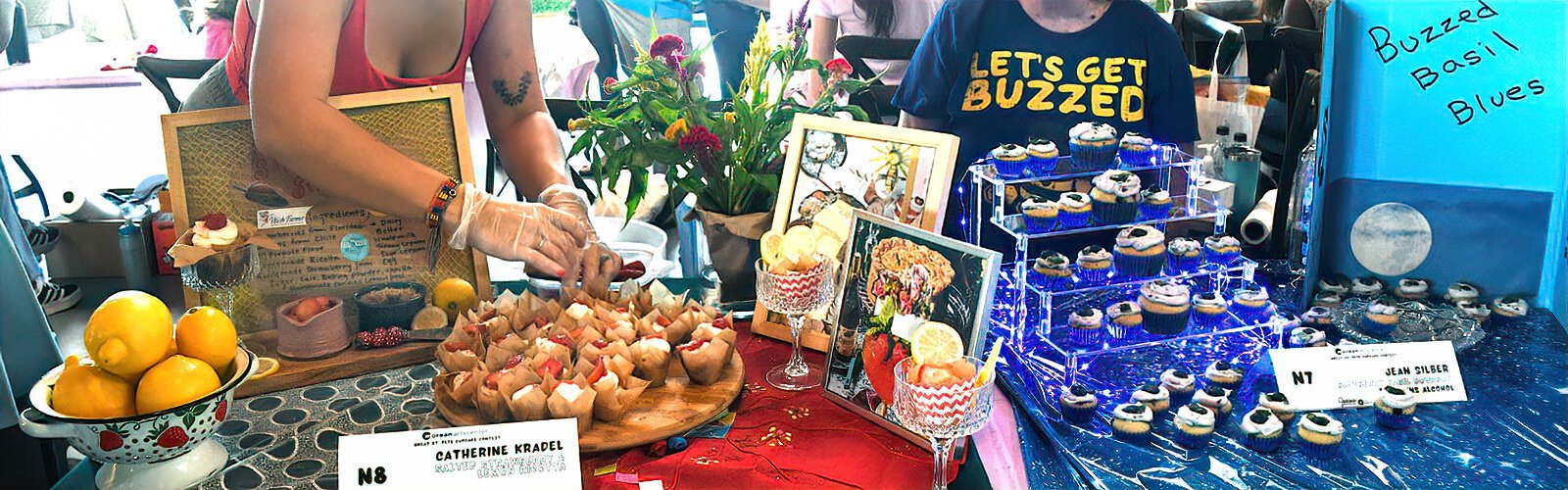  “Salted Strawberry & Lemon Ricotta” by Catherine Kradel is on display next to Jean Silber's “Buzzed Basil Blues” at the Great St. Pete Cupcake Contest.