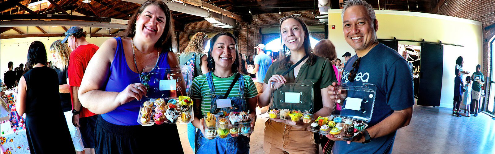 Kristen, Ashley, Krista and Dzuy of St Pete are very happy with their boxes filled with the scrumptious cupcakes they carefully selected at the Great St Pete Cupcake Contest.