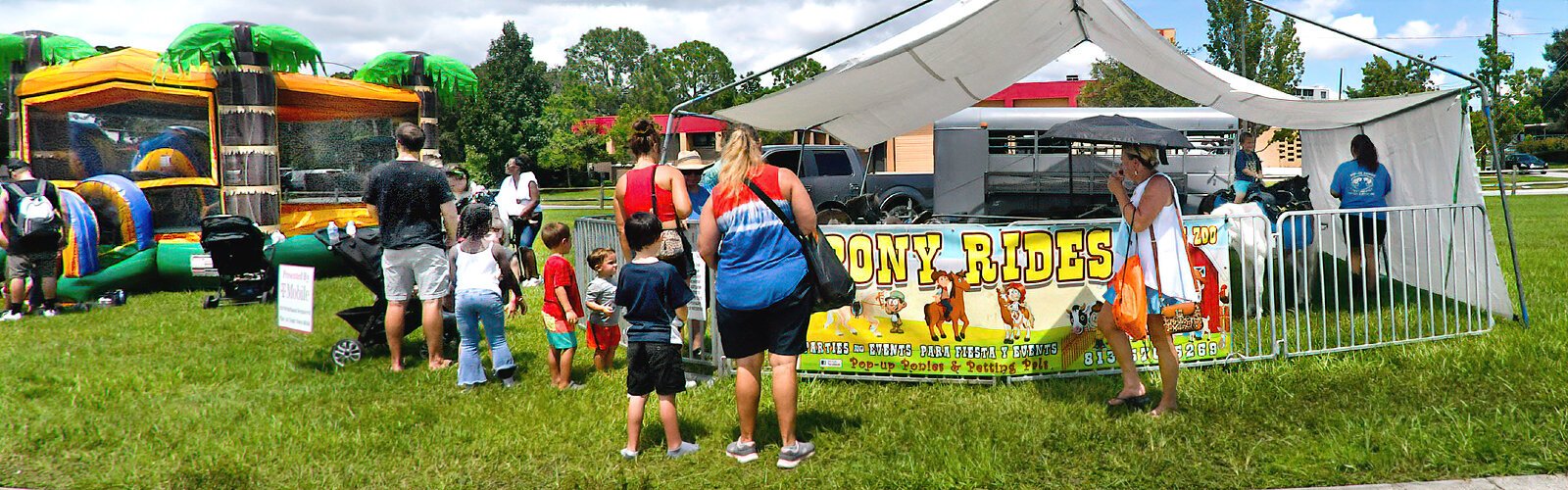 Children wait their turn for a pony ride at the Suncoast Kids Extravaganza.