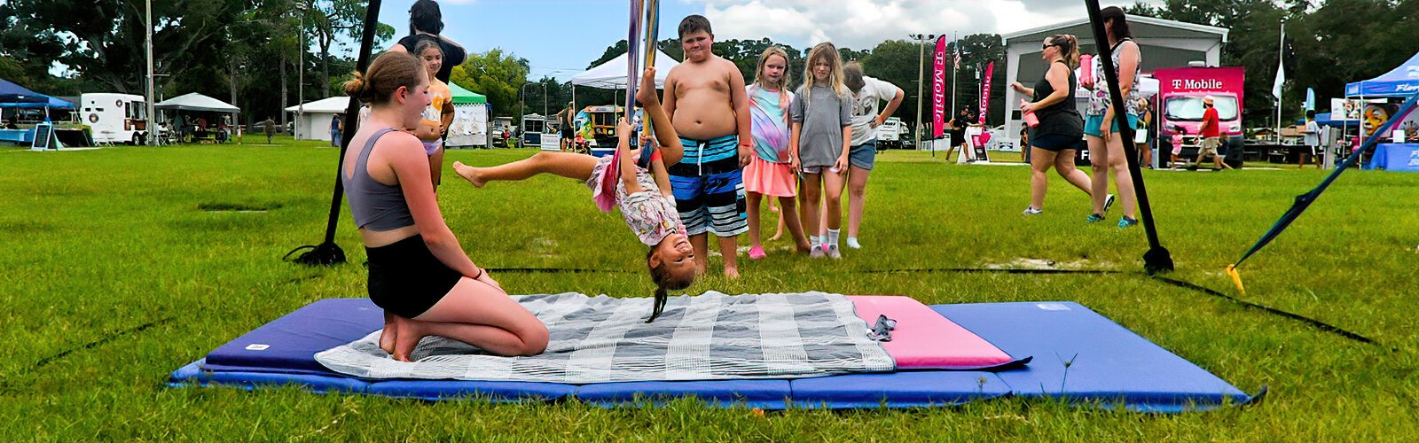 Anna, 5, enjoys the aerial hammock under the watchful eye of coach Rachel Baker from  Pinellas Park's Enchanted Circus Room.