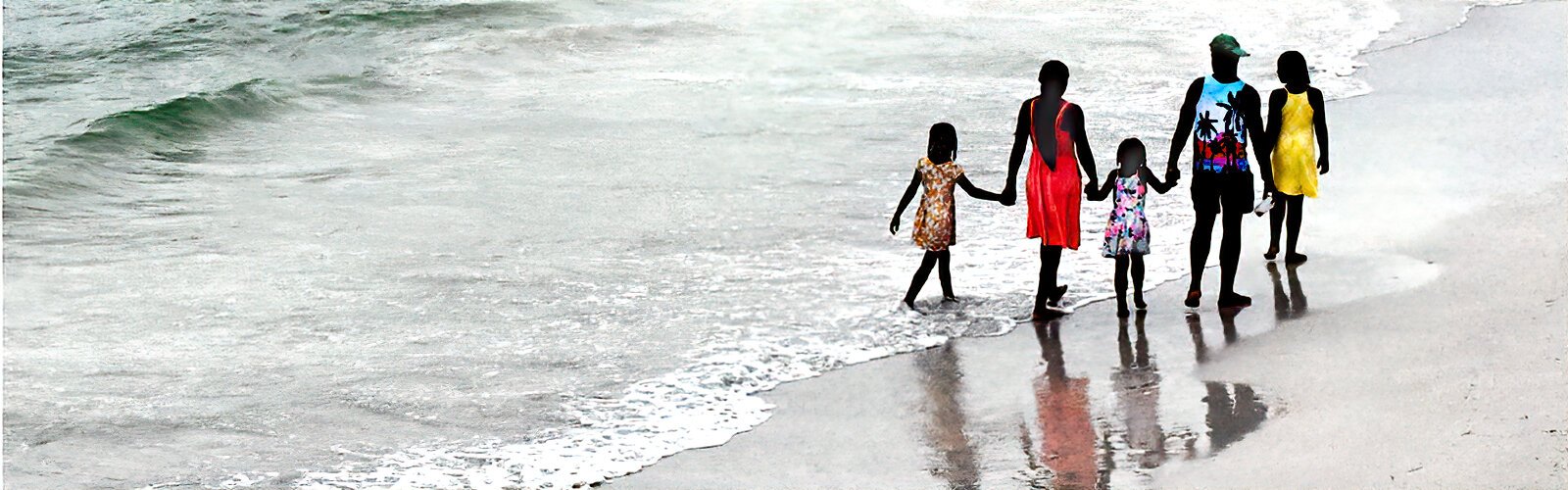  A family enjoys a quiet evening stroll along the surf at Clearwater Beach.