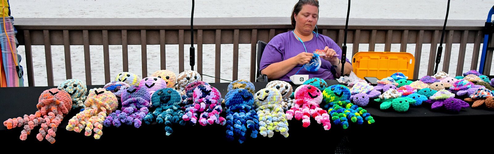 Jeannie Young of Chickadee Yarnworks is crocheting more sea creatures to add to her display of octopuses and turtles.