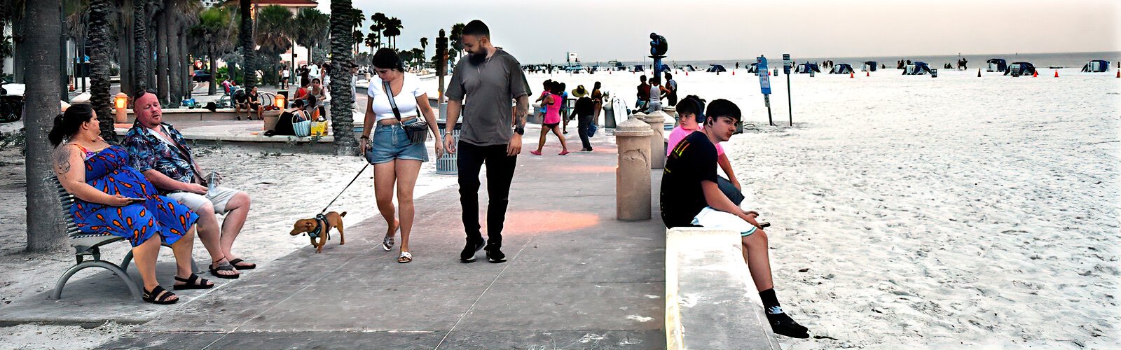  Visitors take an evening stroll along the pedestrian-friendly Beach Walk at Clearwater Beach.