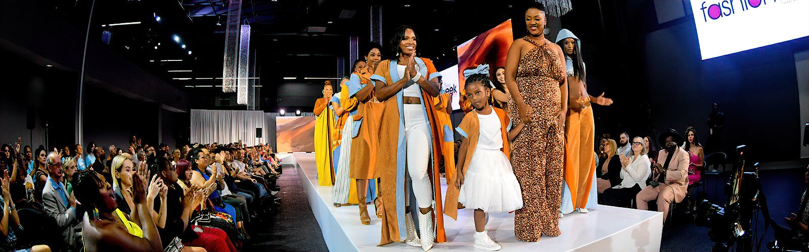 Designer Keyshonna “Key” Miller-McNeil and her models take a bow after making the Sahara come to life with warm shades of sand and sky.