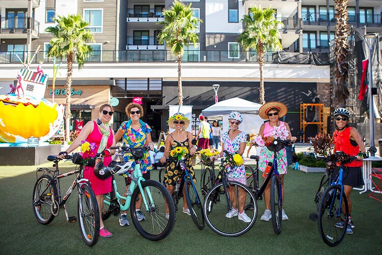 Members of the Fancy Women Bike Ride meet up at Midtown Commons in the Westshore district before a ride downtown to Gasparilla Plaza to escort children participating in the Kidical Mass Ride on World Car-Free Day. 