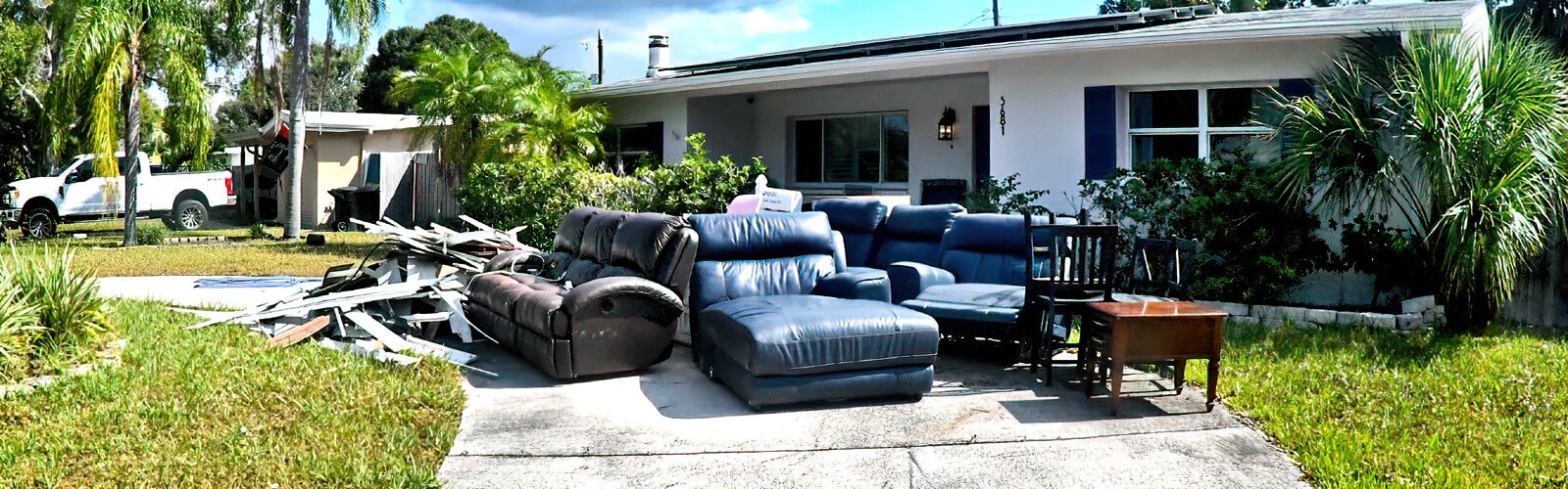 Damaged furniture from a home flooded during Hurricane Helene piled in a driveway in St. Pete’s Shore Acres neighborhood.