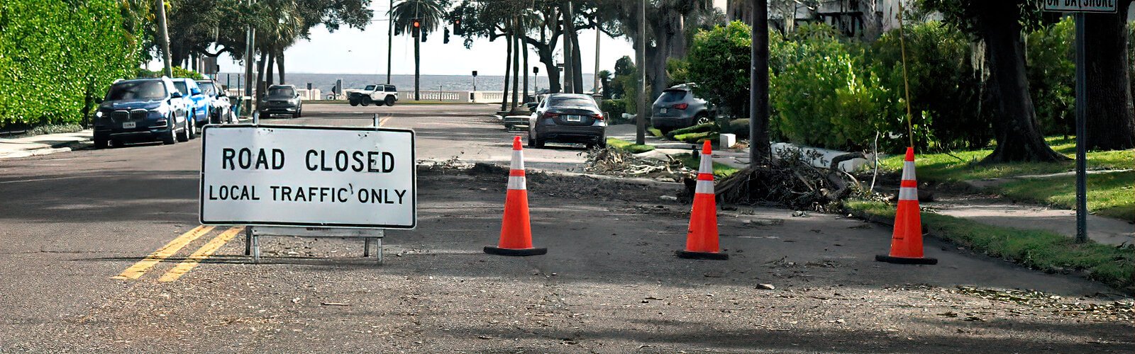 Due to fallen vegetation and debris, a road is partially closed in Tampa’s Bayshore neighborhood.