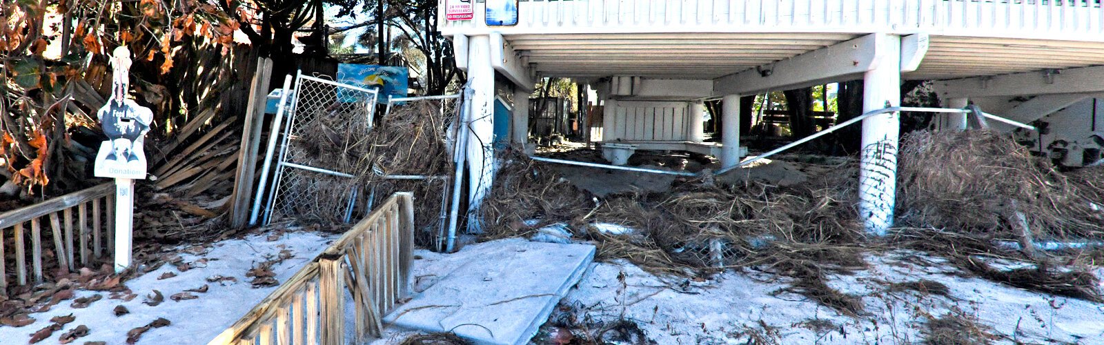 Battered by winds and storm surge, the Seaside Seabird Sanctuary’s beachfront entrance is a silent reminder of the hurricane’s fury, which caused over $300,000 in damages to the rescue facility