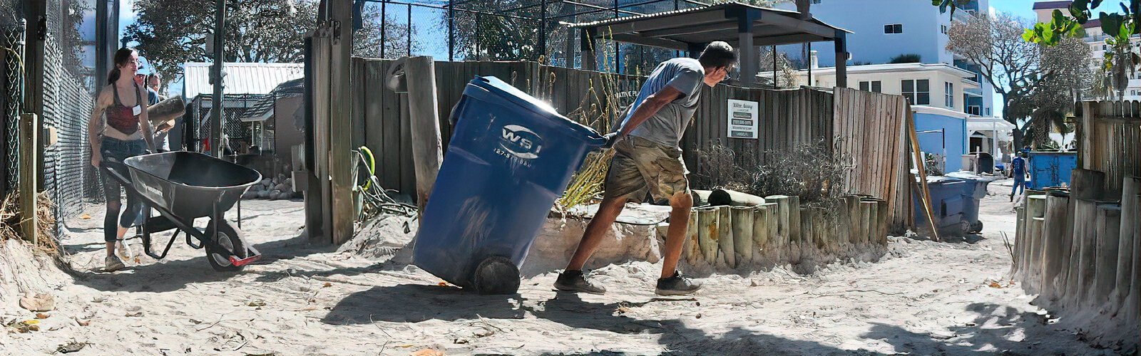 As active as an army of ants, dedicated volunteers go back and forth from the Seaside Seabird Sanctuary to the back parking lot to discard tons of sand and debris.