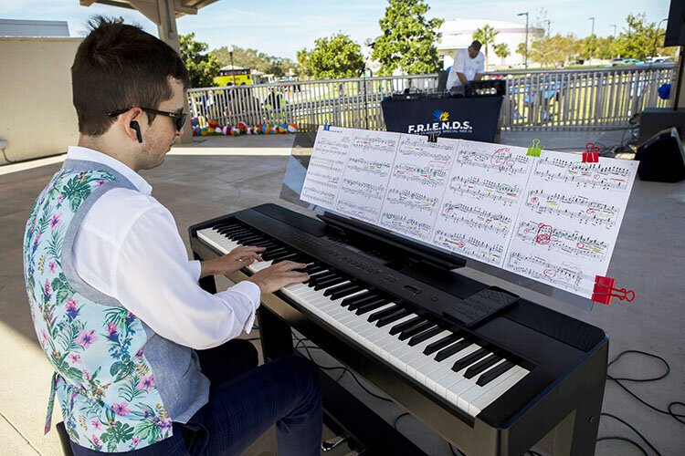 Milosz Gasior of Milosz Defying Autism with Music performs at FRIENDS eighth annual Buddy Walk, presented by Gagnon Foundation