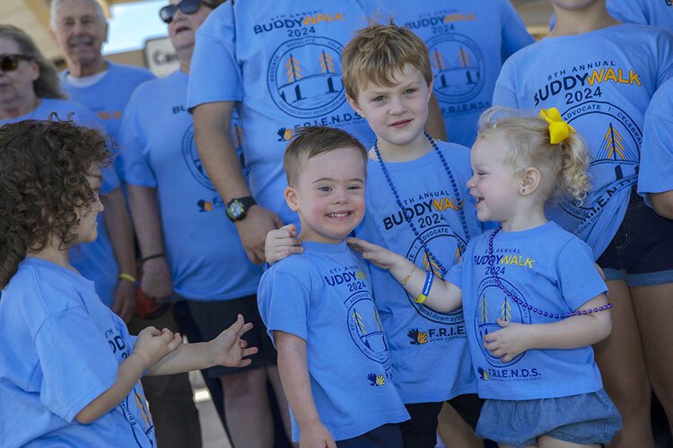 Brody Odom, center, is cheered on by his friends and teammates on "Team Brody Homie with Extra Chromie."