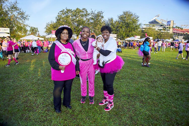 Toni Robinson, a four-year breast cancer survivor, is joined by three generations of her family - grandaughter Destinee Valery, three-month-old great-grandson, Taheem, and daughter LaShonna at Making Strides Against Breast Cancer.