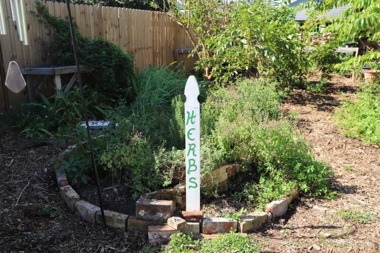 WellFEd Community's community garden off Ybor Street has bountiful fruit trees, vibrant plant beds, a variety of herbs and a pollinator garden drawing in bees and butterflies.