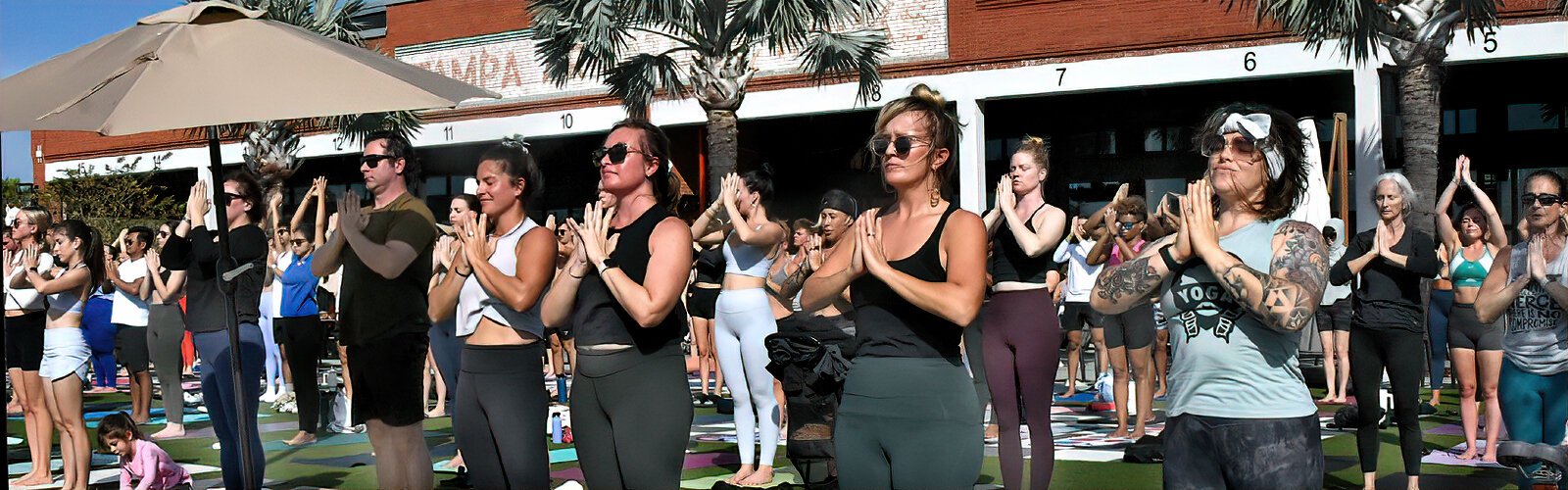 Together with the transformative benefits of this ancient practice, yoga practitioners enjoy a deep sense of community on the lawn of Armature Works in Tampa.