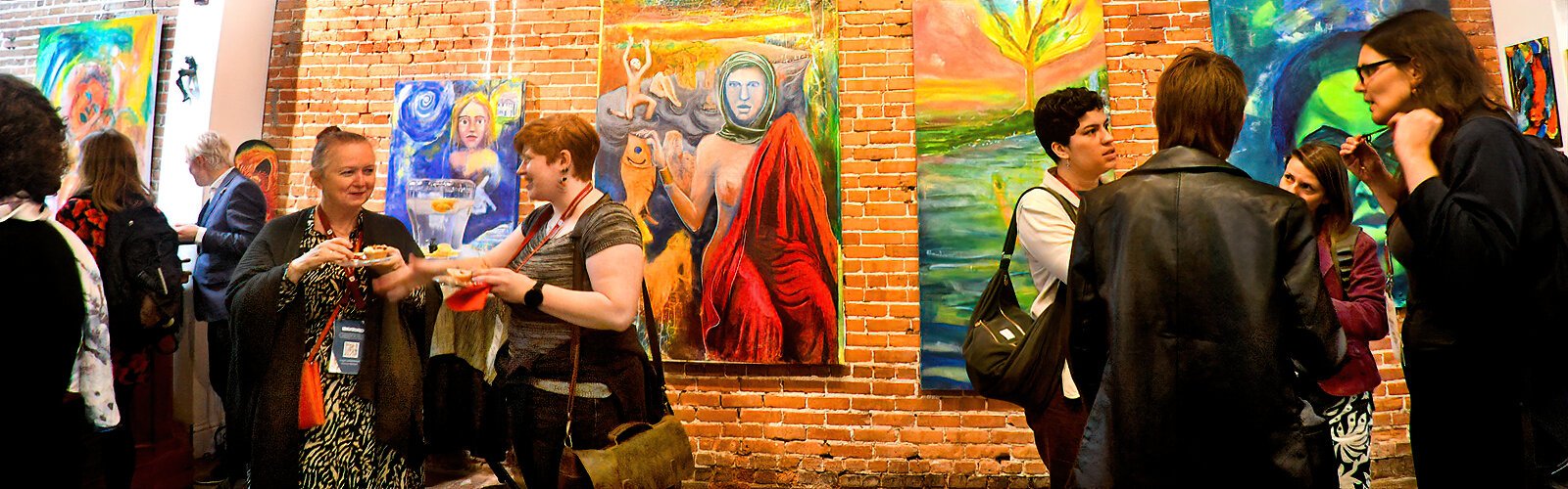 Ybor Arts Tour participants socialize at Marcolina’s Fine Arts Gallery, surrounded by the  artwork of  local and international artists.